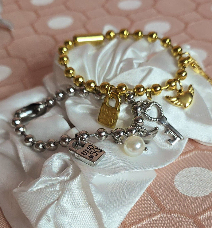 UN- Small White Charms Bracelet